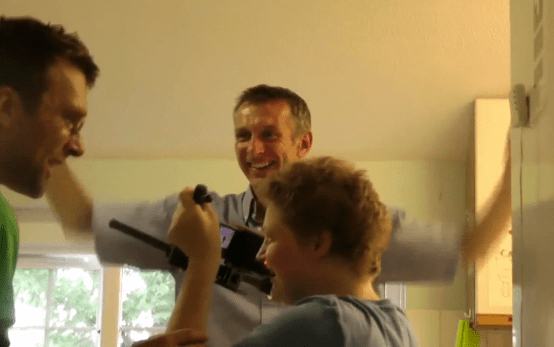 Using steady wings Sarah films Eddie and Malcolm in the kitchen of Cana House