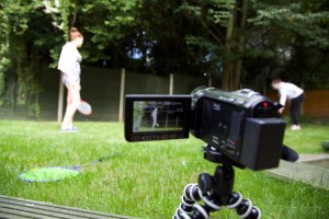 Two of the girls that took part in the project ‘staging’ a game of badminton for the camera in the hostel’s garden