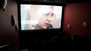 Screenshot from the film at the first official screening. Josh is talking about what he thought a hostel would be like before he had to live in one himself