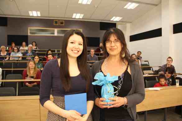 Anastasia To receiving the Runner-Up audience prize from Dr Daniela Peluso.